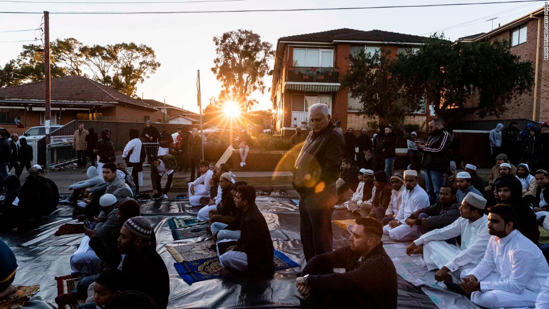 A crowd gathers to pray outside the Lakemba Mosque in Sydney.