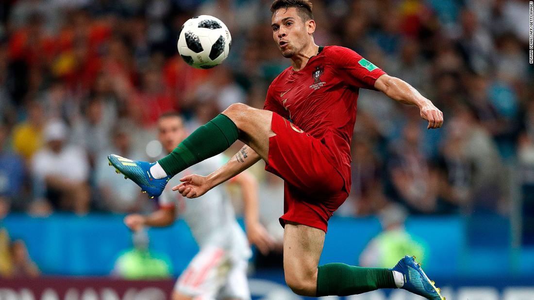 Portuguese defender Raphael Guerreiro controls the ball in the match against Spain.