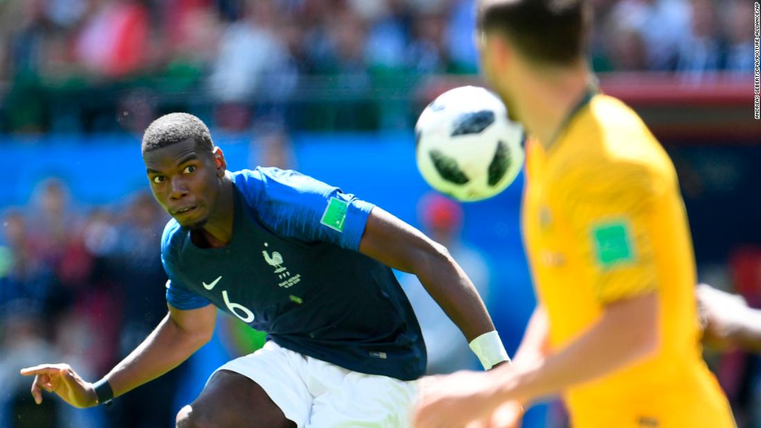 French midfielder Paul Pogba keeps his eye on the ball against Australia. His shot deflected off an Australian for the match-winning goal.