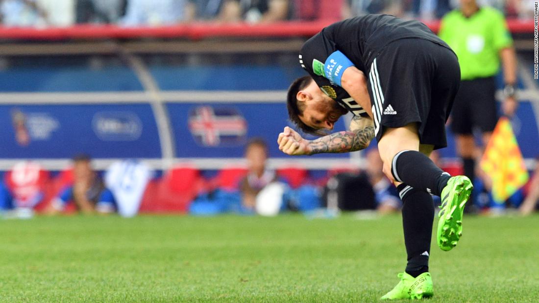 Lionel Messi reacts in frustration after missing a penalty.