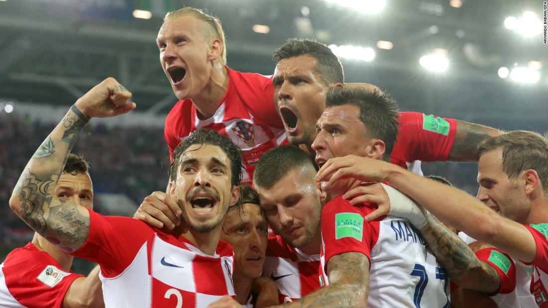 Croatian players celebrate after Luka Modric scored the second goal of their 2-0 win against Nigeria on June 16.