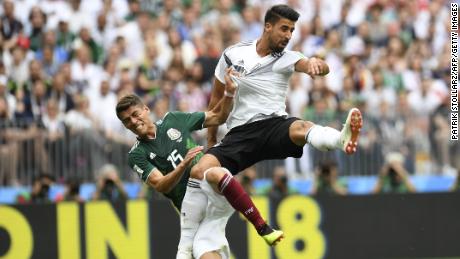 Germany&#39;s midfielder Sami Khedira, right, and Mexico&#39;s defender Hector Moreno fall after attempting to head the ball during the World Cup match between Germany and Mexico in Moscow on Sunday.
