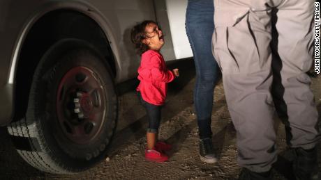 MCALLEN, TX - JUNE 12:  A two-year-old Honduran asylum seeker cries as her mother is searched and detained near the U.S.-Mexico border on June 12, 2018 in McAllen, Texas. The asylum seekers had rafted across the Rio Grande from Mexico and were detained by U.S. Border Patrol agents before being sent to a processing center for possible separation. Customs and Border Protection (CBP) is executing the Trump administration&#39;s &quot;zero tolerance&quot; policy towards undocumented immigrants. U.S. Attorney General Jeff Sessions also said that domestic and gang violence in immigrants&#39; country of origin would no longer qualify them for political asylum status.  (Photo by John Moore/Getty Images)