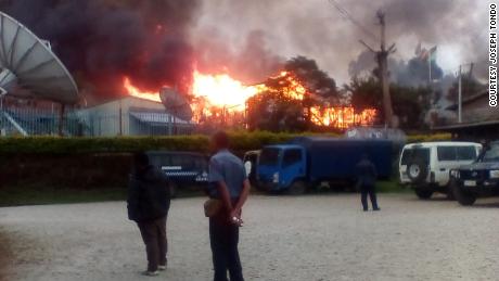 A building is seen on fire during riots in Papua New Guinea&#39;s Southern Highlands province.