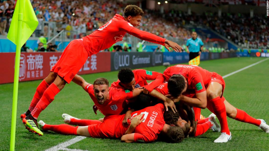 English players celebrate Harry Kane&#39;s first goal in the 2-1 win over Tunisia on June 18. Kane later added the winner in second-half stoppage time.