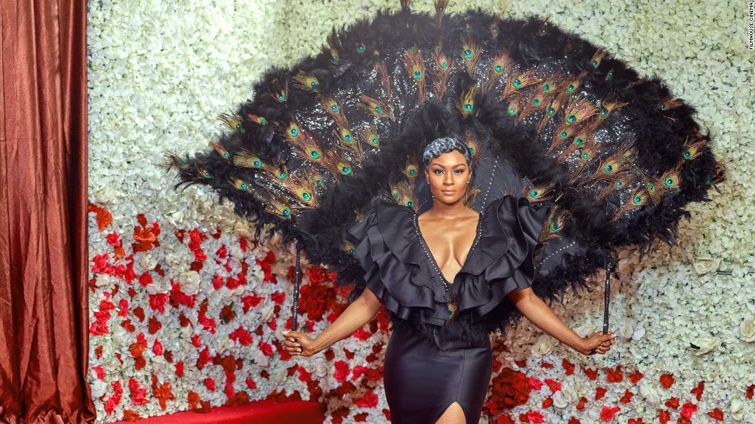 The actress wore a stunning peacock feathered cape designed by costumier Africana. 