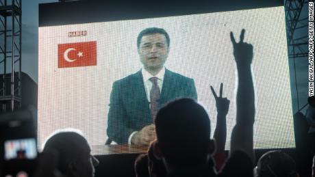 Selahattin Demirtas addresses supporters from jail during his presidential election campaign in June. 