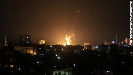 An explosion is seen in northern Gaza City after an airstrike by Israeli forces on June 20, 2018.