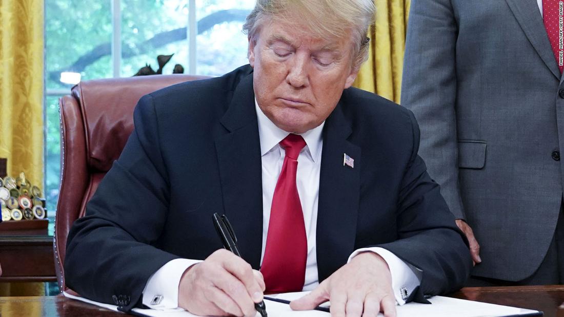 Watched by Homeland Security Secretary Kirstjen Nielsen (L) and Vice President Mike Pence, US President Donald Trump signs an executive order on immigration in the Oval Office of the White House on June 20, 2018 in Washington, DC. - US President Donald Trump on Wednesday signed an executive order aimed at putting an end to the controversial separation of migrant families at the border, reversing a harsh practice that had earned international scorn.&quot;It&#39;s about keeping families together,&quot; Trump said at the signing ceremony. &quot;I did not like the sight of families being separated,&quot; he added. (Photo by Mandel Ngan / AFP) (Photo credit should read MANDEL NGAN/AFP/Getty Images)