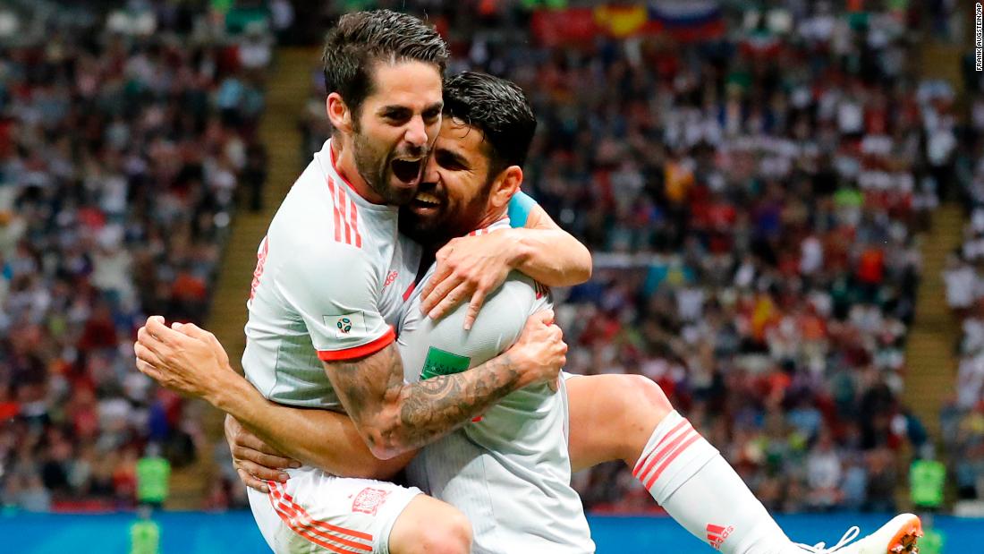 Spain&#39;s Diego Costa, right, celebrates with teammate Isco after scoring against Iran on June 20. Spain won 1-0.