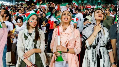 Iranian women cheer for their national team during the screening at Azadi stadium in the capital, Tehran.