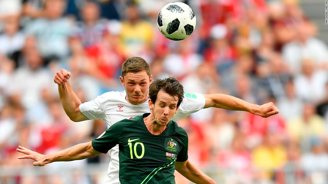 Australia&#39;s Robbie Kruse, foreground, and Denmark&#39;s Henrik Dalsgaard go for a header during the teams&#39; 1-1 draw on June 21.