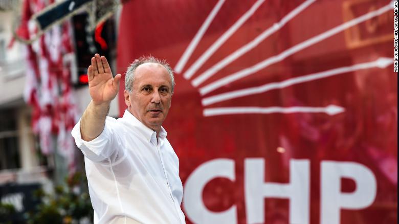 Muharrem Ince waves to supporters from the roof of a campaign bus on June 10 in Istanbul.