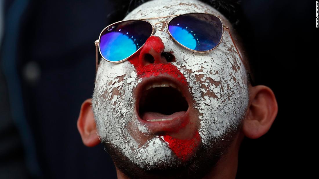 A Peruvian supporter waits for the start of the match.