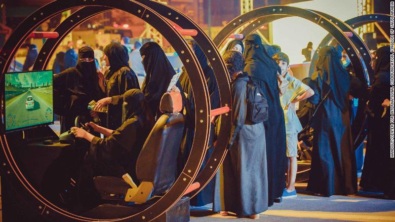 Women take part in a government-organized road safety event at Riyadh Park Mall, in the Saudi capital, on Thursday.