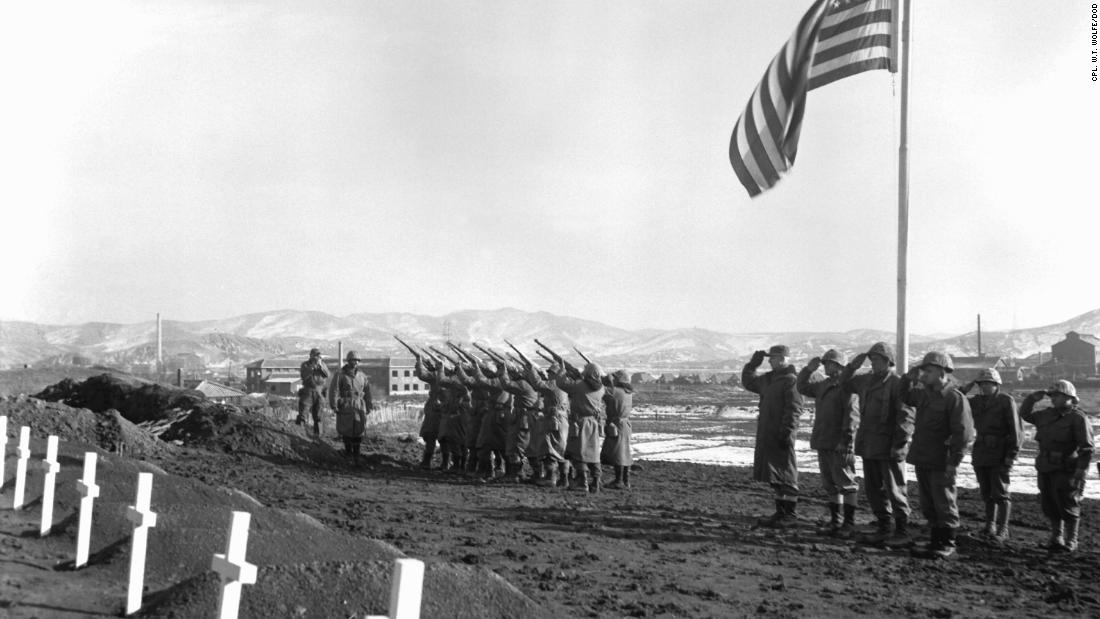A Marine Corps honors brigade fires a volley over the graves of those who fell during the Battle of the Chosin Reservoir, in which over 10,000 Marines were killed. 