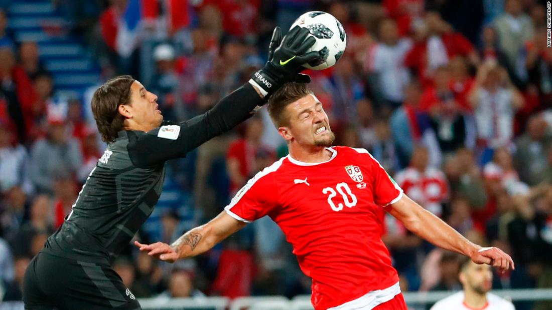 Swiss goalkeeper Yann Sommer catches the ball over Milinkovic-Savic.