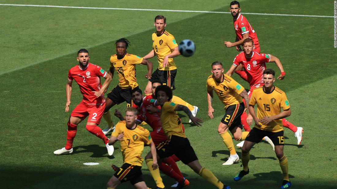 Players watch the ball during the Belgium-Tunisia match.