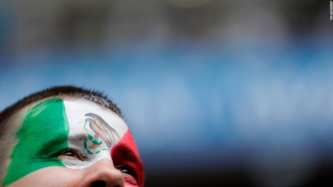 A Mexico fan waits for the start of the match against South Korea.