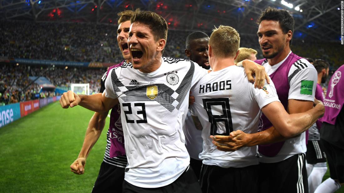 German players celebrate after Toni Kroos scored on a late free kick to stun Sweden 2-1 on June 23.