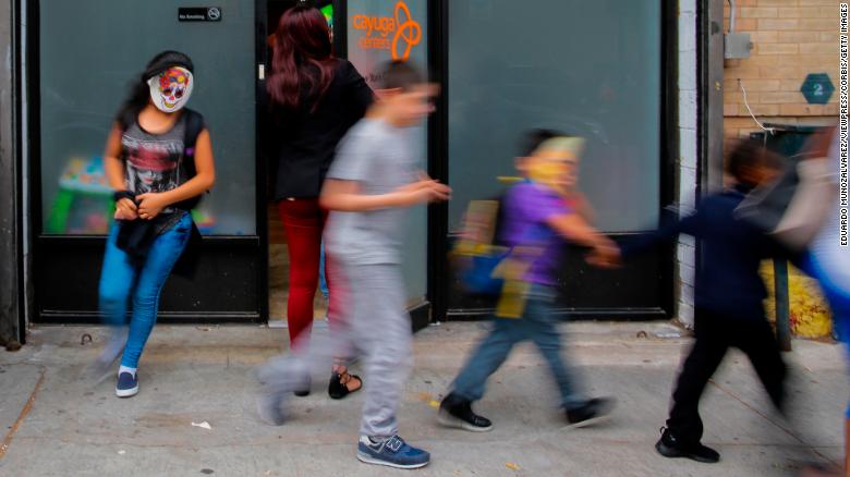 NEW YORK, NY - JUNE 22:  Children with mask exit the CAYUGA Centers branch on June 22, 2018 in Harlem, New York. more than 239 migrant children who were separated from their parents and relatives at the U.S.-Mexico border are under Cayuga Centers care in New York. (Photo by Eduardo MunozAlvarez/VIEWpress/Corbis via Getty Images)