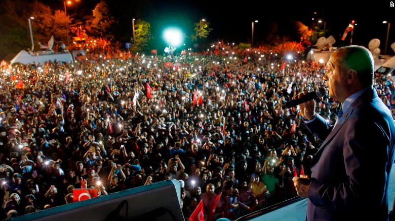 Turkey&#39;s President and leader of ruling Justice and Development Party (AKP) Recep Tayyip Erdogan addresses supporters.