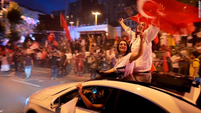 Supporters of Turkey&#39;s ruling Justice and Development Party, or AKP, leader, President Recep Tayyip Erdogan celebrate outside the party headquarters.