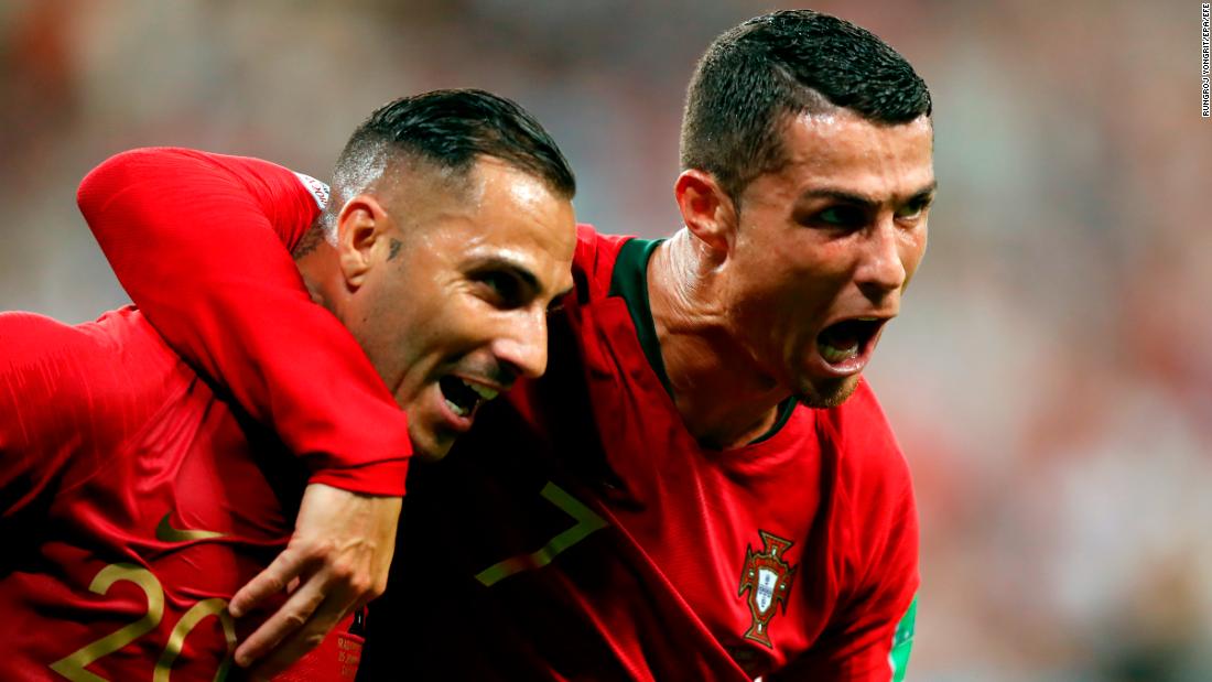 Portugal&#39;s Ricardo Quaresma, left, is embraced by Cristiano Ronaldo after scoring against Iran on June 25. Iran scored late to tie the match, but the 1-1 result was enough to see Portugal into the next round.