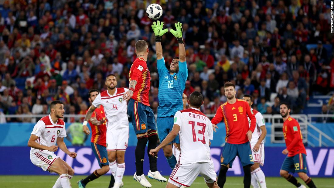 Moroccan goalkeeper Munir catches the ball against Spain. That match ended 2-2, with Spain winning the group.