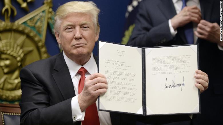 ARLINGTON, VA - JANUARY 27: U.S. President Donald Trump signs executive orders in the Hall of Heroes at the Department of Defense on January 27, 2017 in Arlington, Virginia. Trump signed two orders calling for the &quot;great rebuilding&quot; of the nation&#39;s military and the &quot;extreme vetting&quot; of visa seekers from terror-plagued countries. (Photo by Olivier Douliery/Pool/Getty Images)