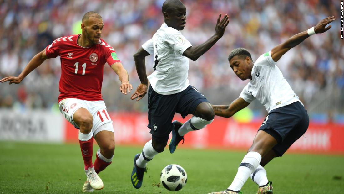 Denmark&#39;s Martin Braithwaite, left, is tracked by France&#39;s N&#39;Golo Kante, center,  and Presnel Kimpembe.