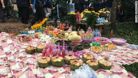 Food, left by the parents of the missing boys, as an offering to spirits to keep their sons safe. 