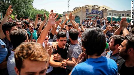 Protesters chant slogans at the main gate of the Grand Bazaar on Monday.