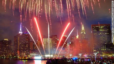 The Empire State Building and the Christal Building are seen during the Macy&#39;s 4th of July fireworks show from Queens, New York on July 4, 2017. / AFP PHOTO / EDUARDO MUNOZ ALVAREZ        (Photo credit should read EDUARDO MUNOZ ALVAREZ/AFP/Getty Images)