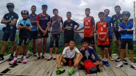 The missing boys, with their coach, are seen here in a photo taken from the coach's Facebook page.