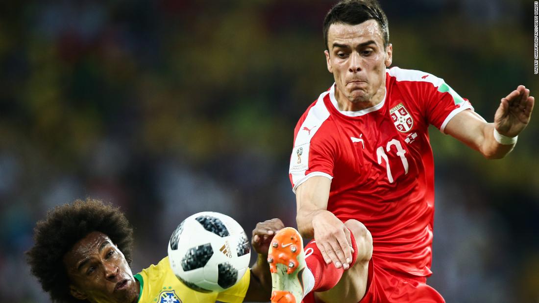 Brazil&#39;s Willian and Serbia&#39;s Filip Kostic fight for the ball.