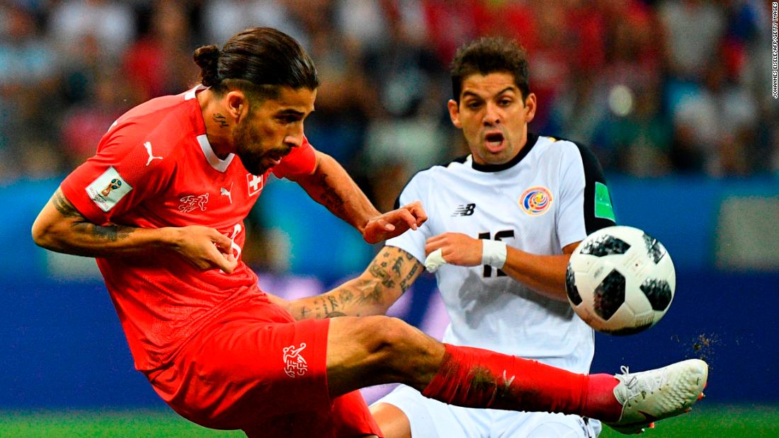 Costa Rican defender Cristian Gamboa, right, closes in on Switzerland&#39;s Ricardo Rodriguez.