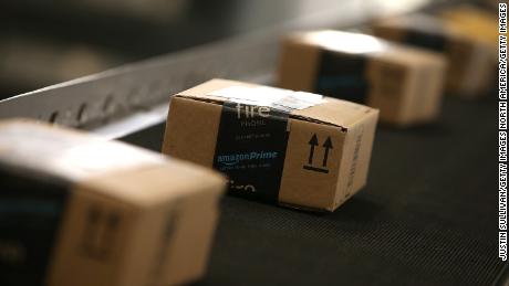 Boxes move along a conveyor belt at an Amazon fulfillment center.