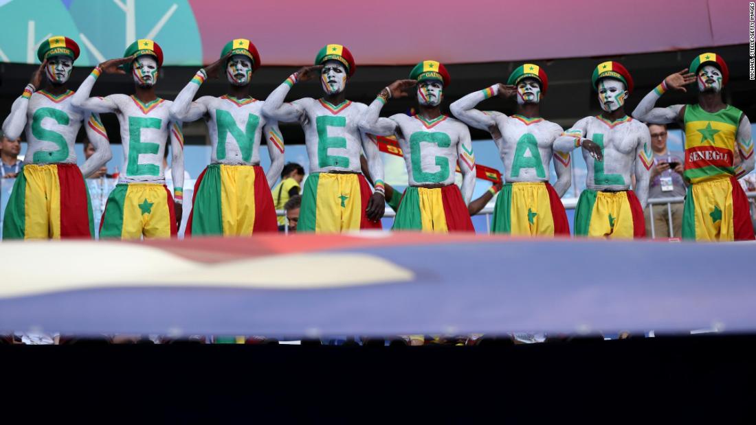 Senegal fans salute before the match against Colombia.