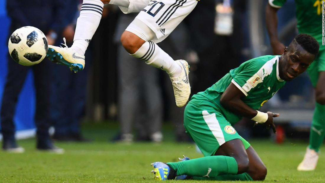 Colombia&#39;s Juan Quintero jumps over Senegal&#39;s Idrissa Gana Gueye. Senegal finished with four points in Group H, the same as Japan, but Japan advanced on the &quot;fair play points&quot; tiebreaker. Japan had two fewer yellow cards in the tournament than Senegal. 