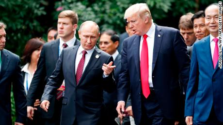 US President Donald Trump (R) and Russia&#39;s President Vladimir Putin chat as they walk together to take part in the &quot;family photo&quot; during the Asia-Pacific Economic Cooperation (APEC) leaders&#39; summit in the central Vietnamese city of Danang on November 11, 2017.
World leaders and senior business figures are gathering in the Vietnamese city of Danang this week for the annual 21-member APEC summit. / AFP PHOTO / POOL / JORGE SILVA        (Photo credit should read JORGE SILVA/AFP/Getty Images)