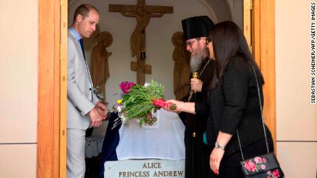 Britain's Prince William visits the grave of his great-grandmother, Princess Alice of Battenberg, during a visit to the Church of Mary Magdalene in Jerusalem on June 28, 2018. 
