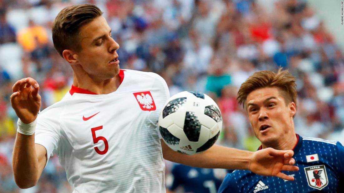 Poland&#39;s Jan Bednarek, left, competes for the ball with Japan&#39;s Gotoku Sakai on June 28. Poland won 1-0, but Japan advanced to the next round.