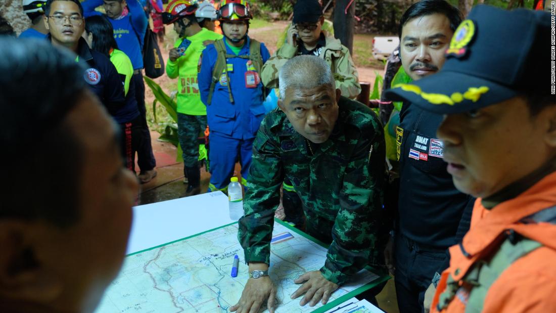 Thai officials plan over a map of the Tham Luang Nang Non caves.