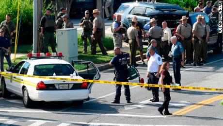 Police secure the scene of a shooting at an office building housing The Capital Gazette newspaper in Annapolis, Md., Thursday, June 28, 2018. (AP Photo/Susan Walsh)