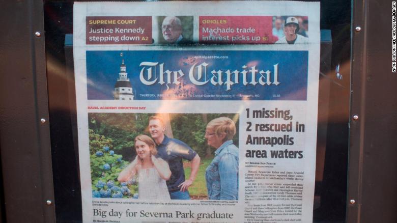 A newspaper stand selling the Capital Gazette. 