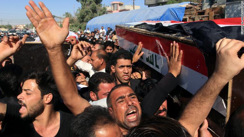 Iraqis carry the coffin of a victim who was kidnapped and then executed by Islamic state group in Karbala city, southern Iraq on Thursday. 