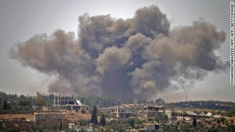 Smoke rises above opposition held areas of the city of Dara&#39;a during airstrikes by Syrian regime forces on June 28, 2018. 