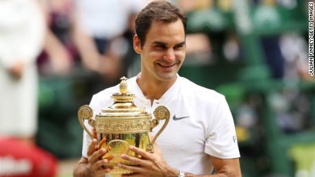 LONDON, ENGLAND - JULY 16:  Roger Federer of Switzerland celebrates victory with the trophy after the Gentlemen&#39;s Singles final against  Marin Cilic of Croatia on day thirteen of the Wimbledon Lawn Tennis Championships at the All England Lawn Tennis and Croquet Club at Wimbledon on July 16, 2017 in London, England.  (Photo by Julian Finney/Getty Images)