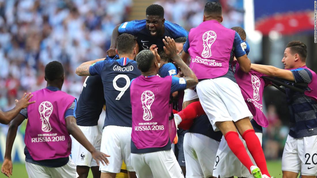 French players celebrate after Benjamin Pavard tied the match at 2-2.